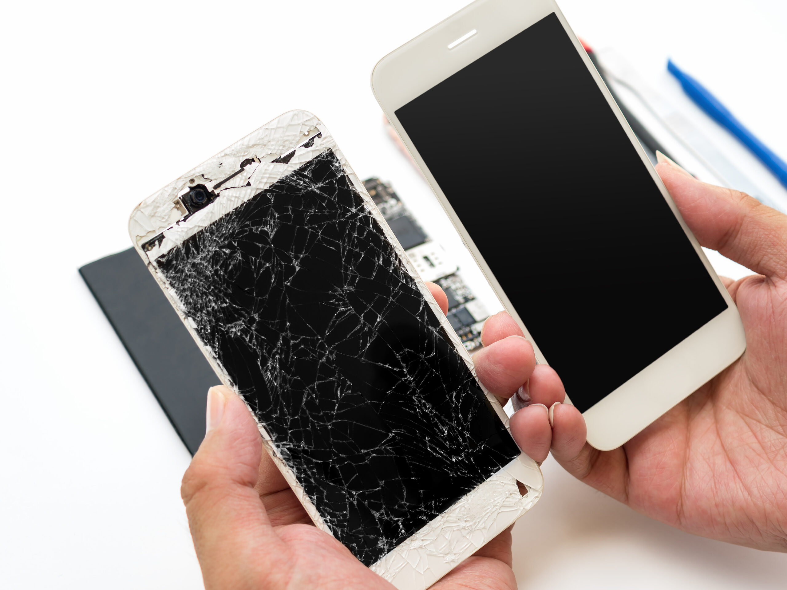 Cracked Phone next to Fixed Phone